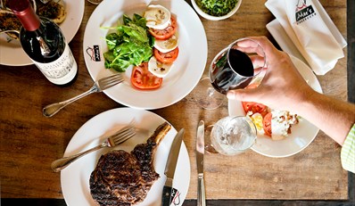 $55 -- Mac's: Steak &amp; Seafood Dinner for 2 w/Wine, Reg. $113