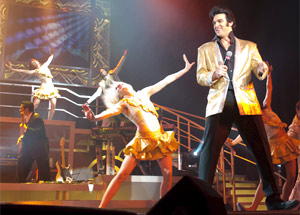 Elvis impersonator with dancers