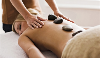 $49 -- Time Out-Praised Spa: Hot Stone Massage or Facial